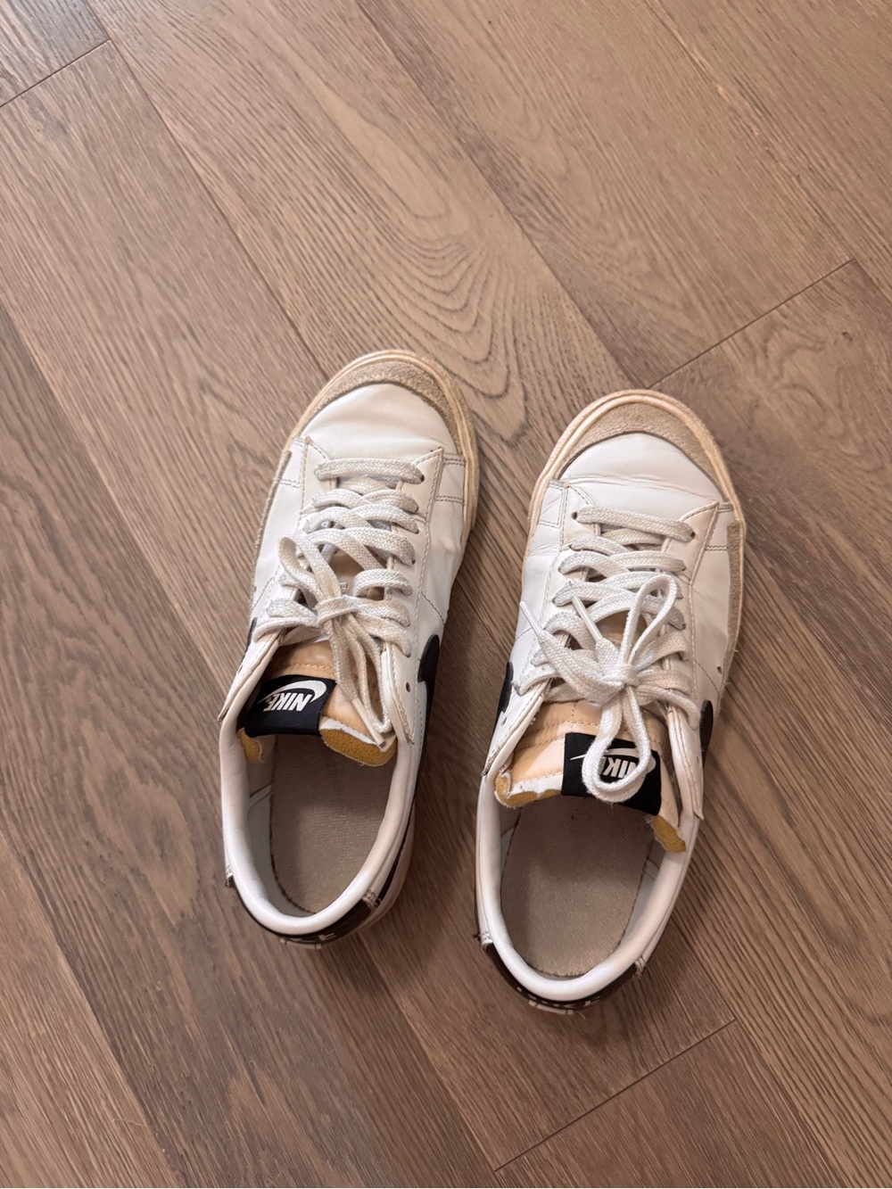Nike White Sneakers with Black Swoosh and Tan Accents